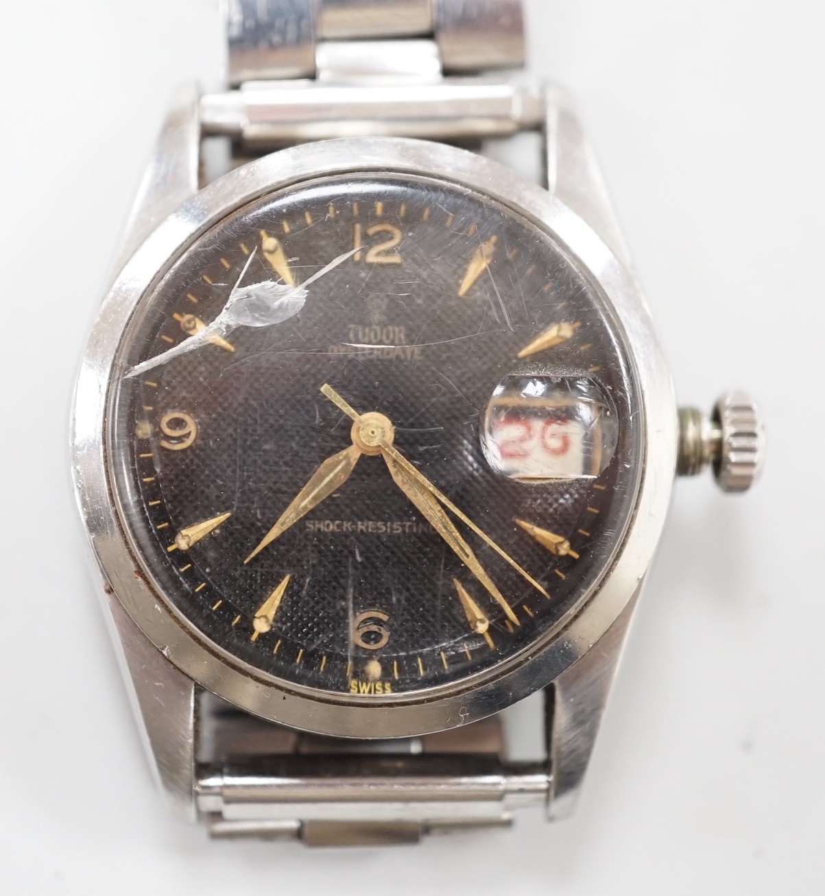 A gentleman's late 1950's? stainless steel Tudor Oysterdate manual wind wrist watch with black honeycomb dial, on associated stainless steel bracelet, case diameter 34mm, the case back numbered 7929 over 204837, no box o